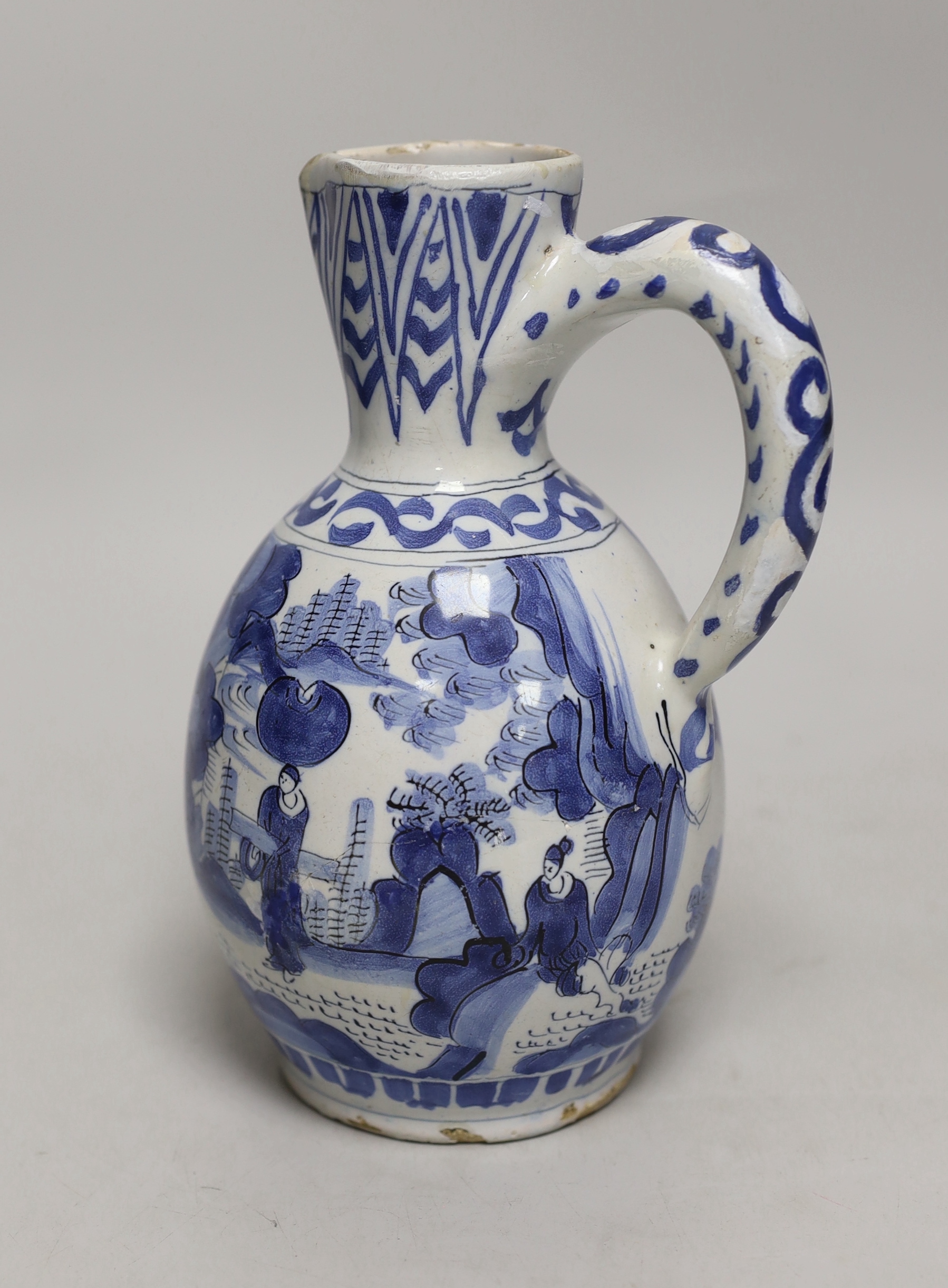 A late 17th century Delft blue and white ewer and three Chinese style tumblers and saucers, tallest 20cm